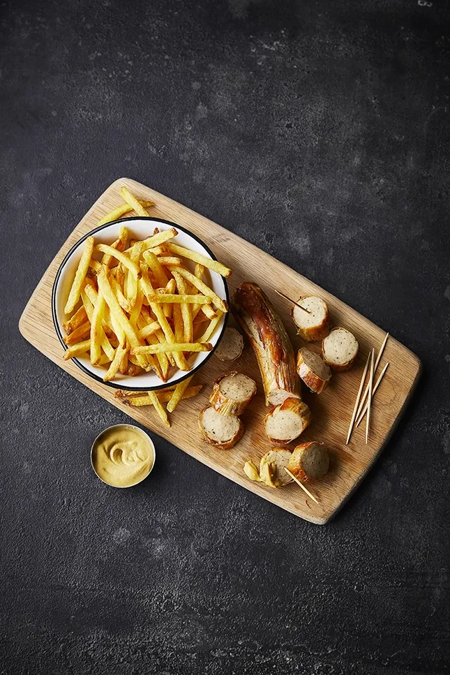 Bratwurst on slate background